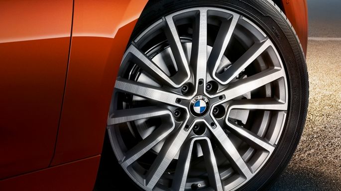 Alloy wheel BMW 2 Series Active Tourer Alloy wheel BMW 2 Series Active Tourer F45 Sunset Orange metallic close-up wheel