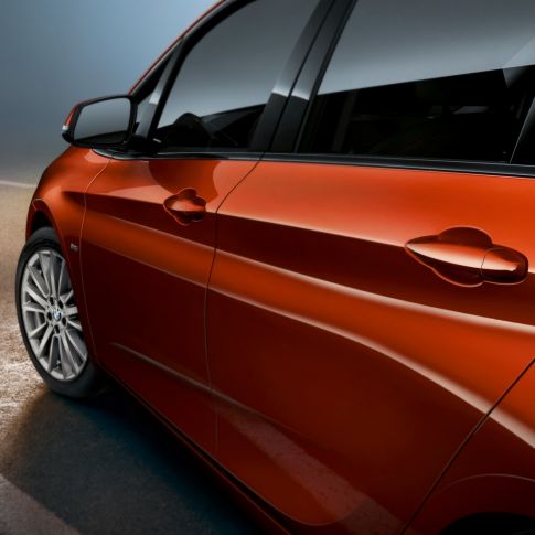 Close-up side BMW 2 Series Active Tourer BMW 2 Series Active Tourer F45 Sunset Orange metallic close-up side