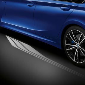 BMW 3 Series, Welcome Light Carpet Detailed side view of the open driver's door with Welcome Light Carpet.