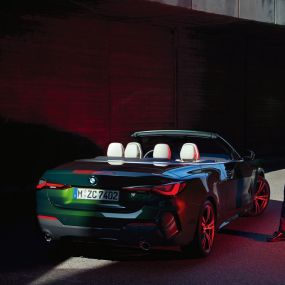 Three-quarter rear view with rear lights BMW 4 Series Convertible G23 2020 BMW 4 Series Convertible G23 2020 Sanremo Green metallic three-quarter rear view with rear lights