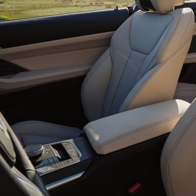 Centre console and seats of the BMW 4 Series Convertible G23 BMW 4 Series Convertible G23 2020 Sanremo Green metallic interior centre console and seats