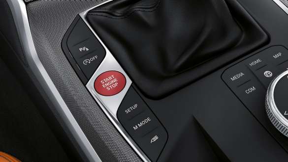 Red Start/Stop button interior Red Start/Stop button centre console interior