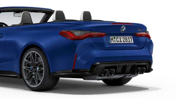 Rear design BMW M4 Competition Convertible with M xDrive G83 2021 BMW M4 Cabrio exterior Competition G83 2021 BMW Individual Frozen Portimao Blue metallic Rear design three-quarter rear view