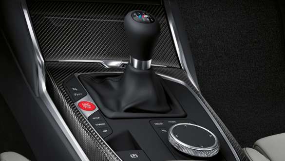 Manual M transmission and rear-wheel drive G82 2020 G82 2020 Manual 6-speed M transmission and rear-wheel drive close-up centre concole and gear lever