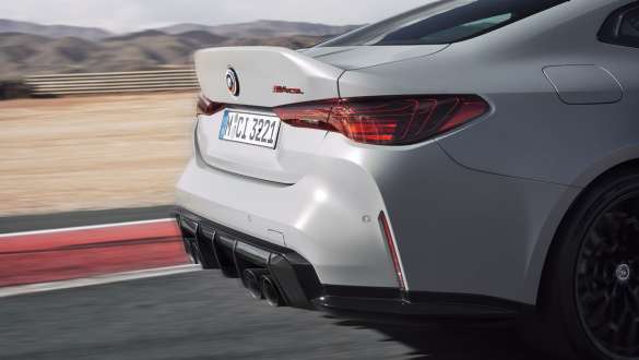 Tailgate with integrated rear spoiler BMW M4 CSL G82 BMW M4 CSL G82 BMW Individual Frozen Brooklyn Grey metallic side close-up tailgate with rear spoiler