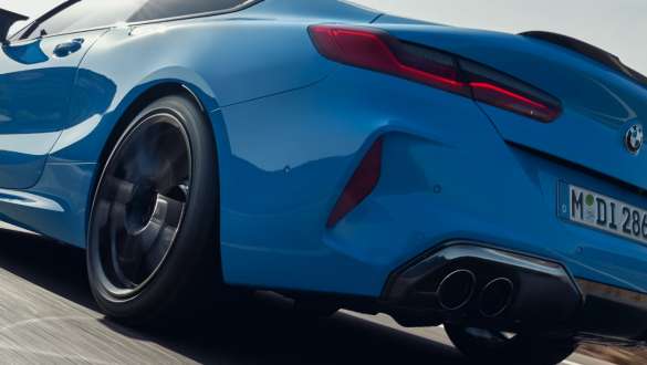 M xDrive BMW M8 Competition Coupé F92 LCI Facelift 2022 BMW M8 Competition Coupé F92 LCI Facelift 2022 Daytona Beach Blue uni driving rear view low-angle shot M xDrive