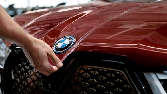 BMW vehicle checks and maintenance BMW vehicle checks and maintenance hand on BMW bonnet