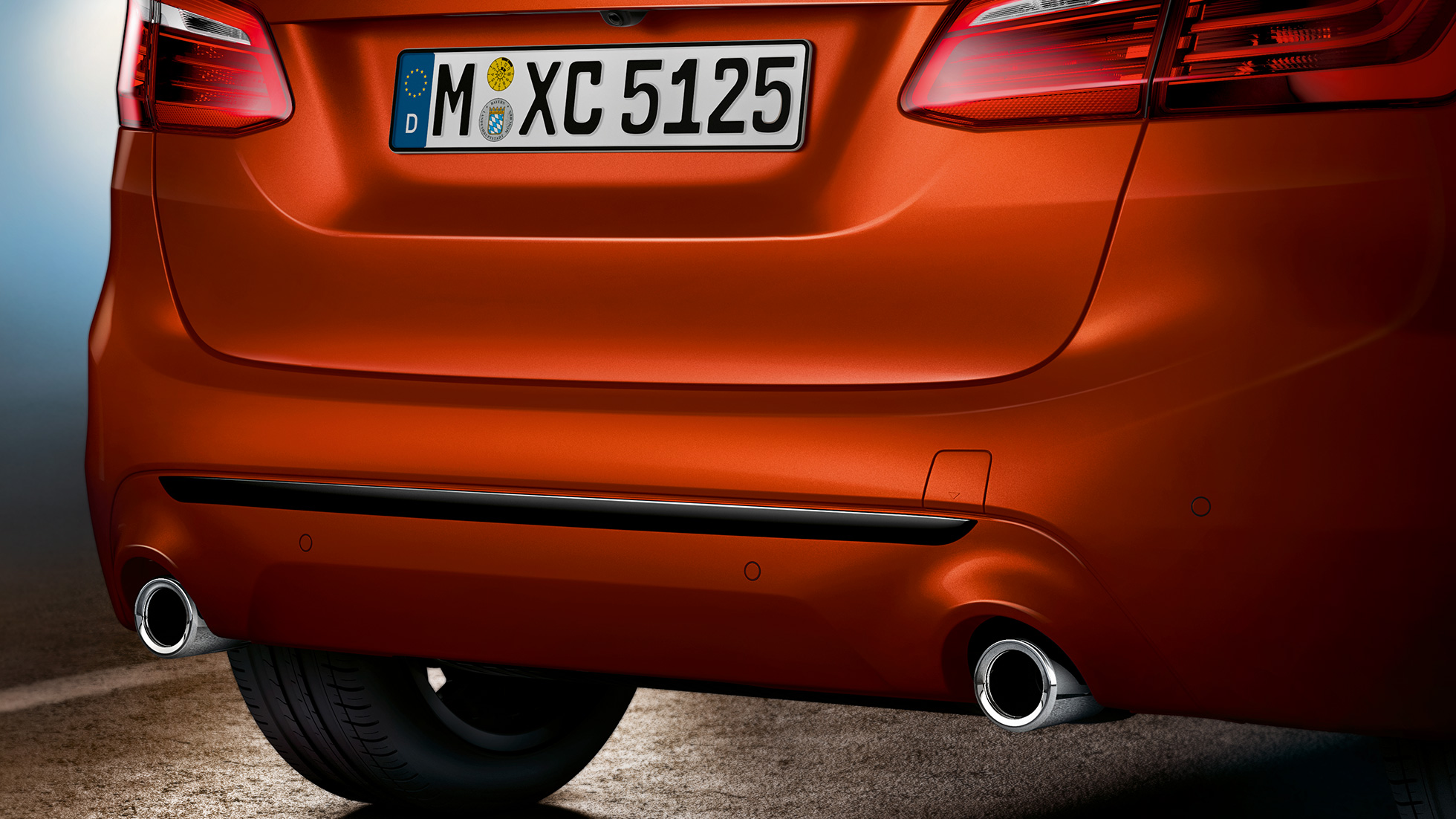 Rear section BMW 2 Series Active Tourer Rear section BMW 2 Series Active Tourer 220i F45 Sunset Orange metallic close-up rear