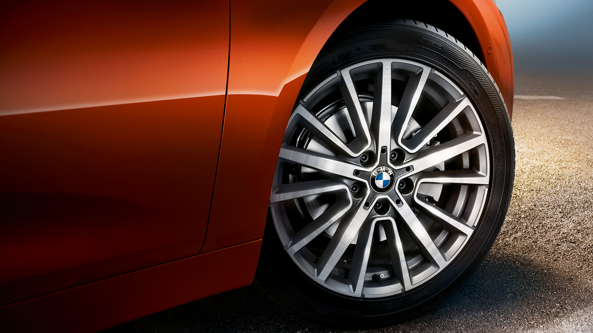 Alloy wheel BMW 2 Series Active Tourer Alloy wheel BMW 2 Series Active Tourer F45 Sunset Orange metallic close-up wheel