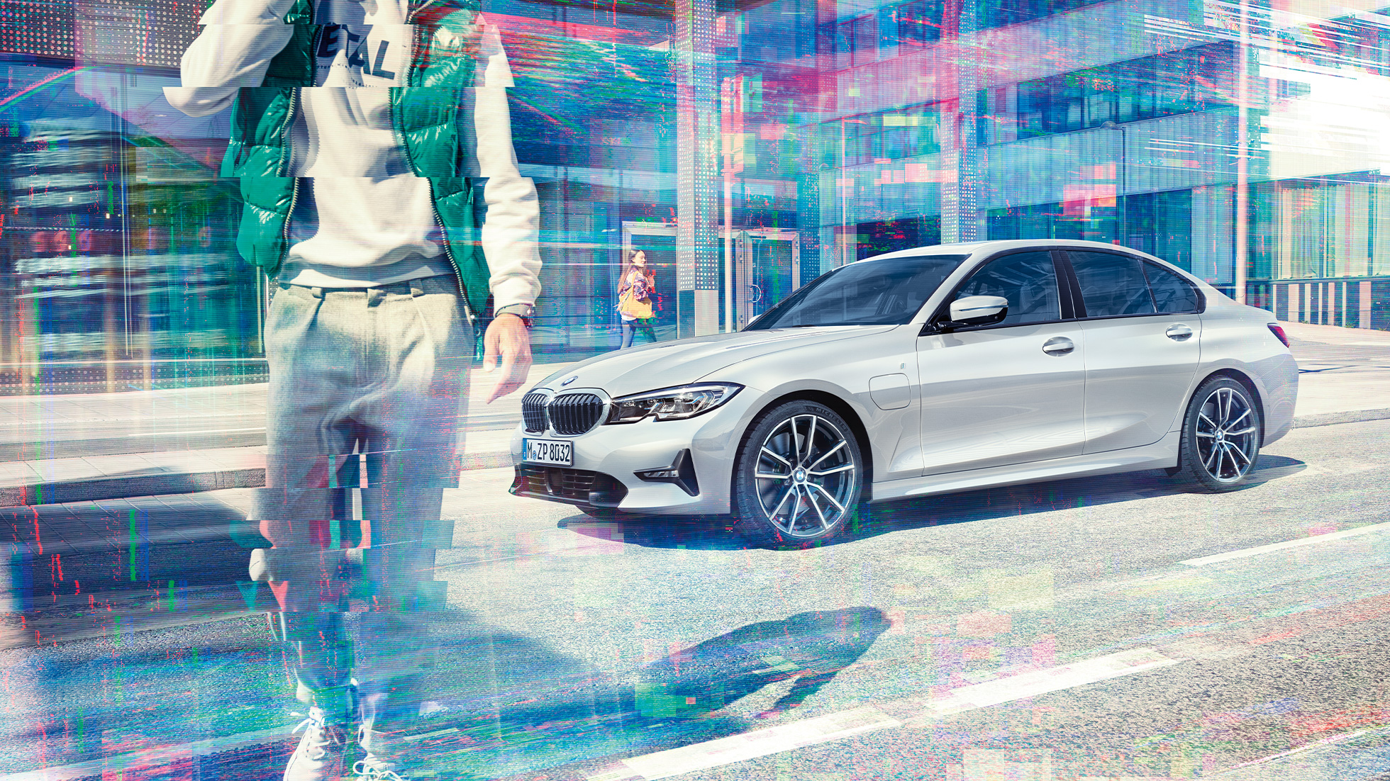 Side view BMW 3 Series Sedan BMW 330e BMW 3 Series Sedan BMW 330e G20 Glaciersilver metallic side view while driving