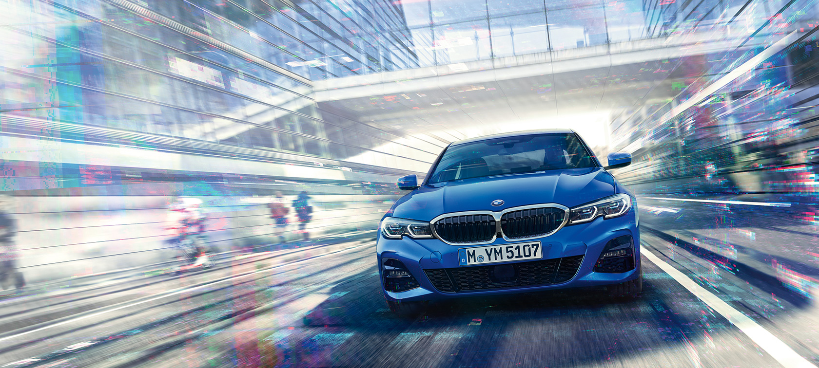BMW 3 Series Sedan, front view Front view of driving BMW 3 Series Sedan by day under glass building.