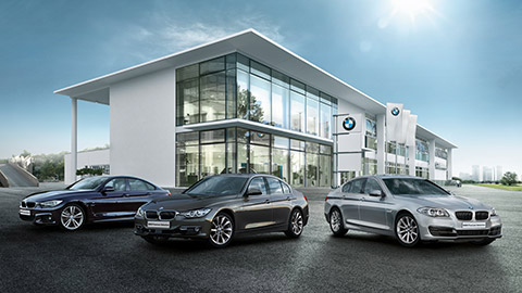 BMW 4 Series BMW Approved Used Cars in front of BMW car dealership