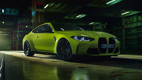 BMW M4 G82 three-quarter side view standing BMW M Series BMW M4 G82 three-quarter side view standing