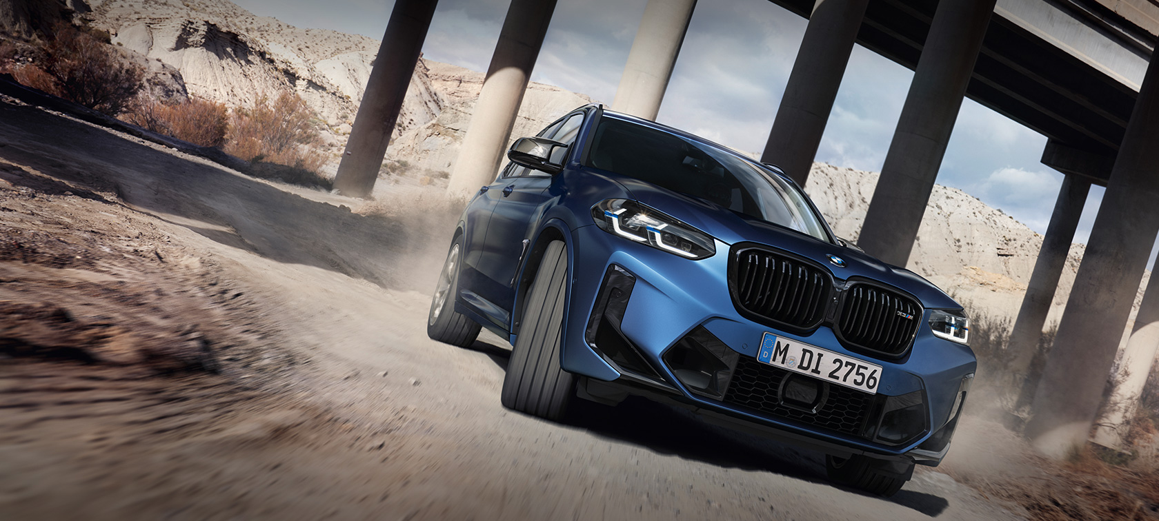 BMW X3 M F97 LCI 2021 three-quarter front view driving BMW X3 M F97 LCI Facelift 2021 Frozen Marina Bay Blue metallic three-quarter front view driving