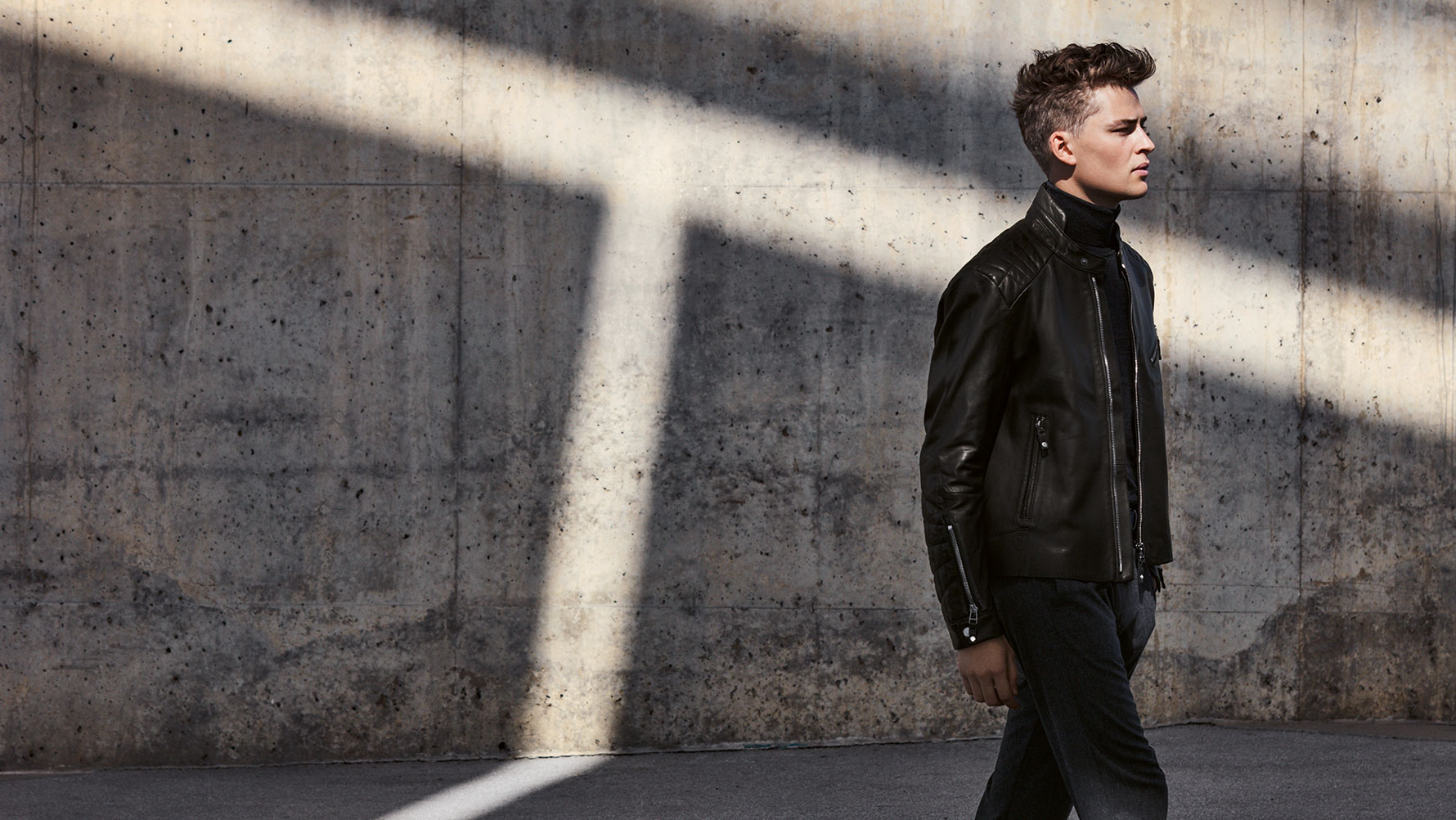 A male model presents the Men's Leather Jacket from the BMW Collection. A male model presents the Men's Leather Jacket from the BMW Collection.
