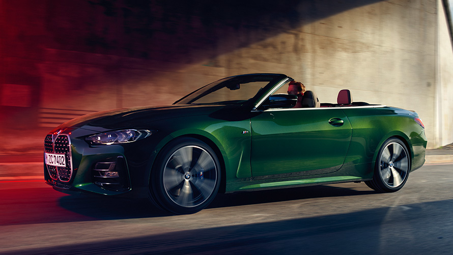 Remote Software Upgrade 21-03 BMW 4 Series Convertible driving on the street Remote Software Upgrade 21-03 BMW 4 Series Convertible driving on the street three-quarter side view