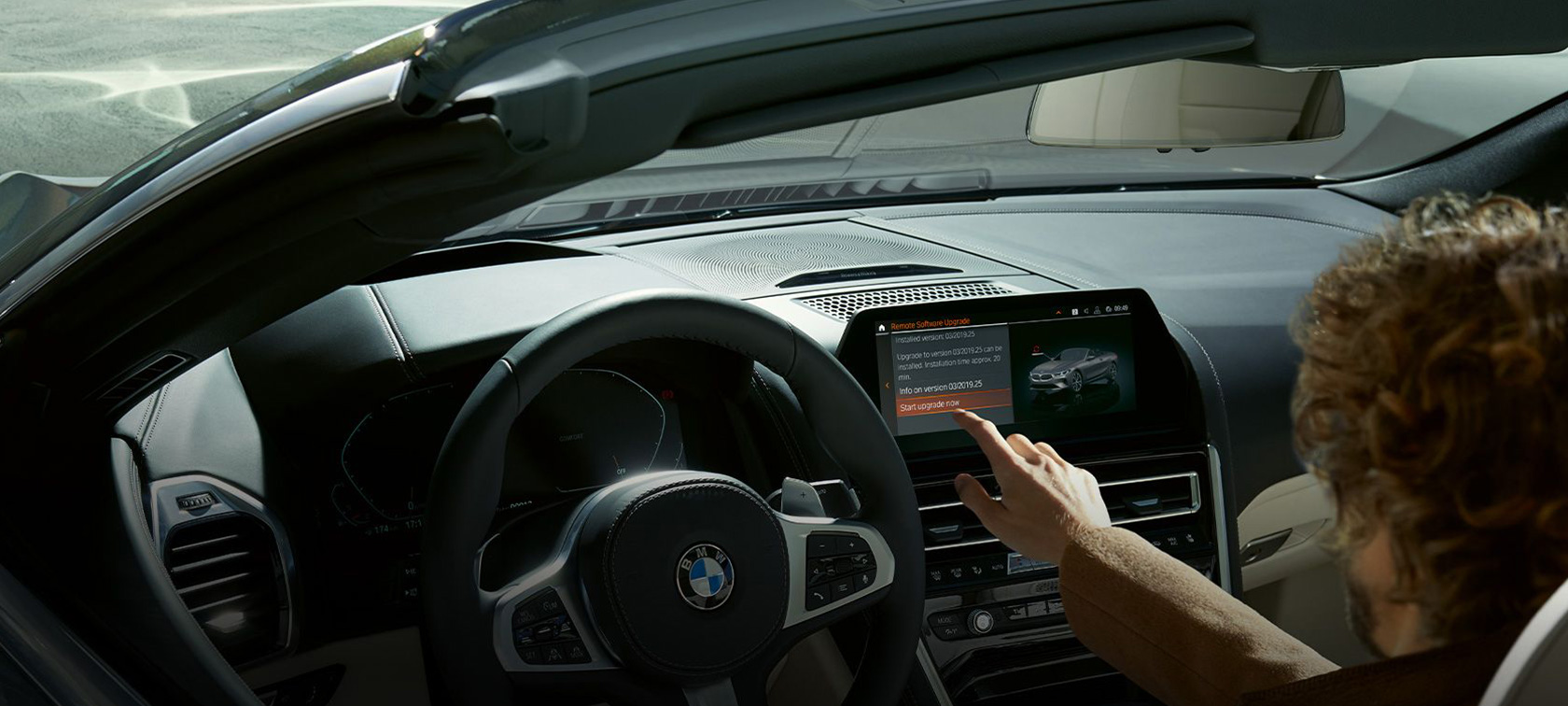 BMW Remote Software Upgrade Man sitting in BMW starting the BMW Remote Software Upgrade